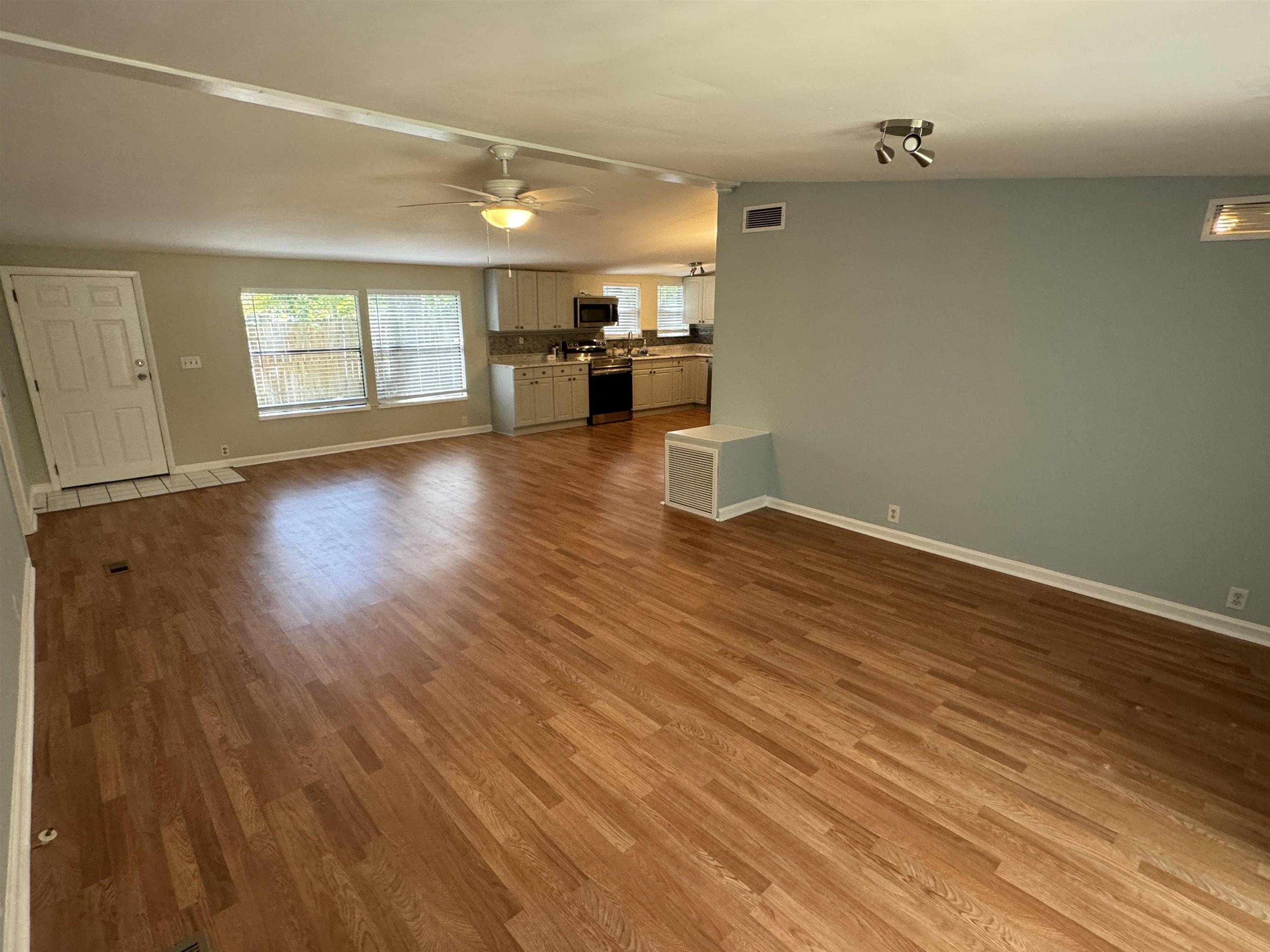 4430 Manucy Road, Unit C St. Augustine, FL 32084 - Photo 5 of 26 wooden floor in an empty room with a window