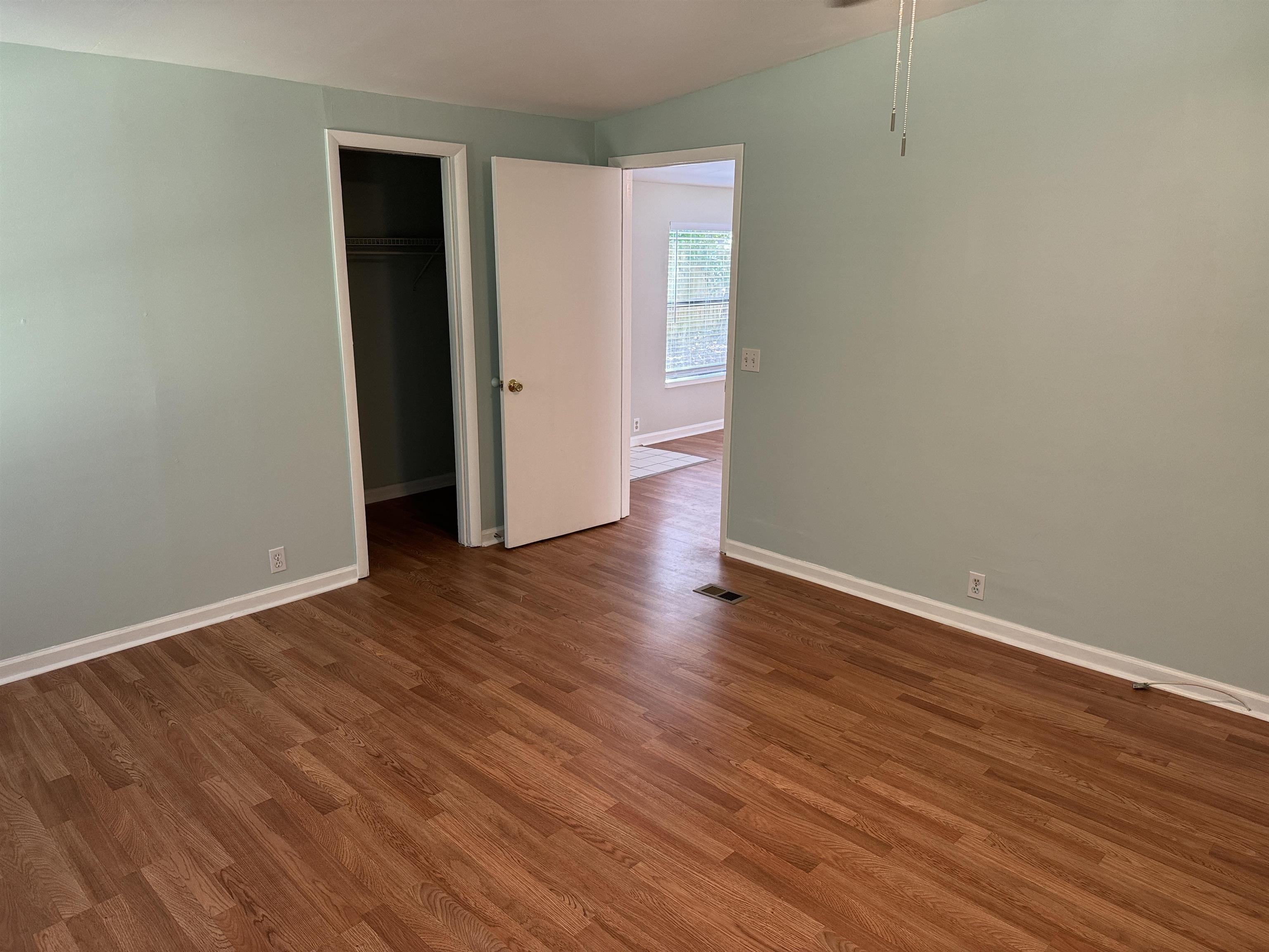 4430 Manucy Road, Unit C St. Augustine, FL 32084 - Photo 8 of 26 a view of an empty room with wooden floor and closet