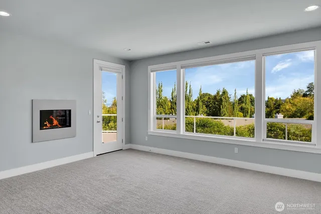 an empty room with windows and view