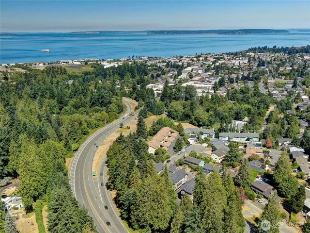 a view of a house with a yard balcony and sitting area