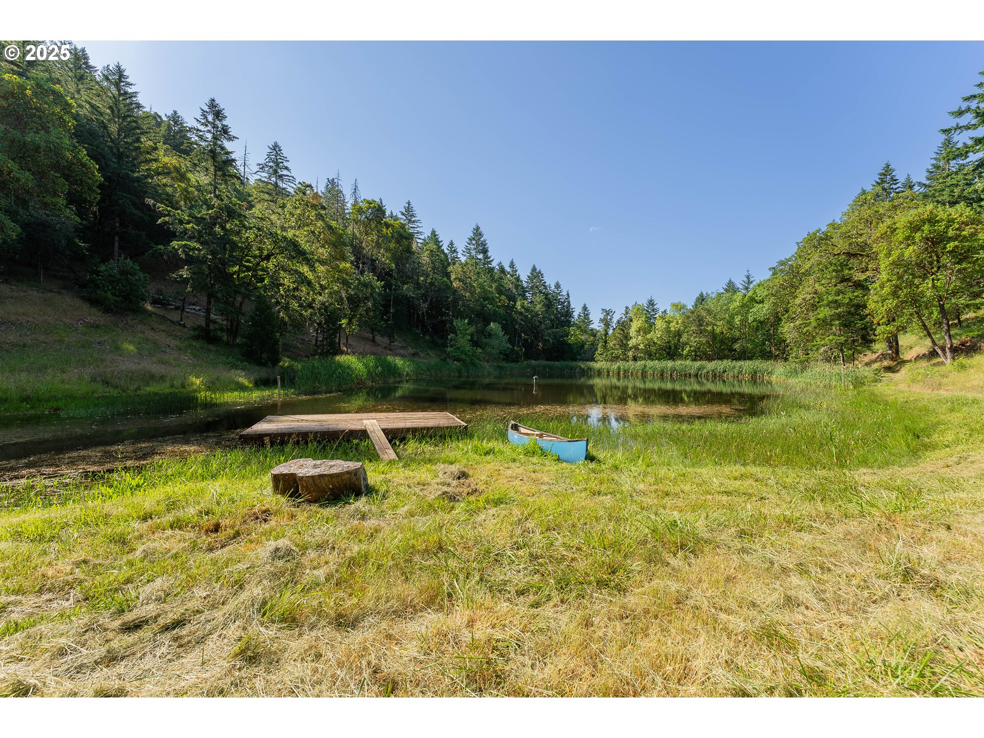 1180 Upper Cleveland Rapids Road Roseburg, OR 97471 - Photo 15 of 42 a view of a lake with houses in the background