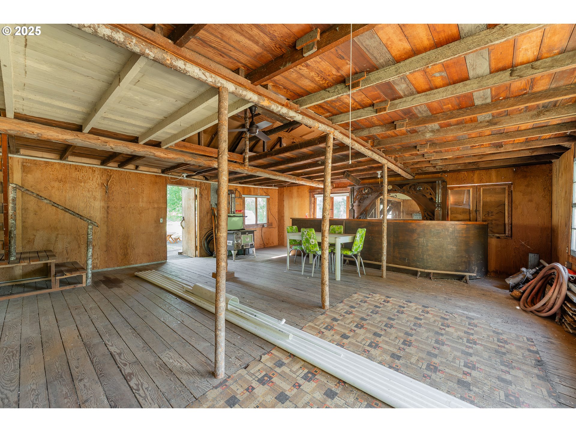 1180 Upper Cleveland Rapids Road Roseburg, OR 97471 - Photo 8 of 42 a view of a room with wooden floor