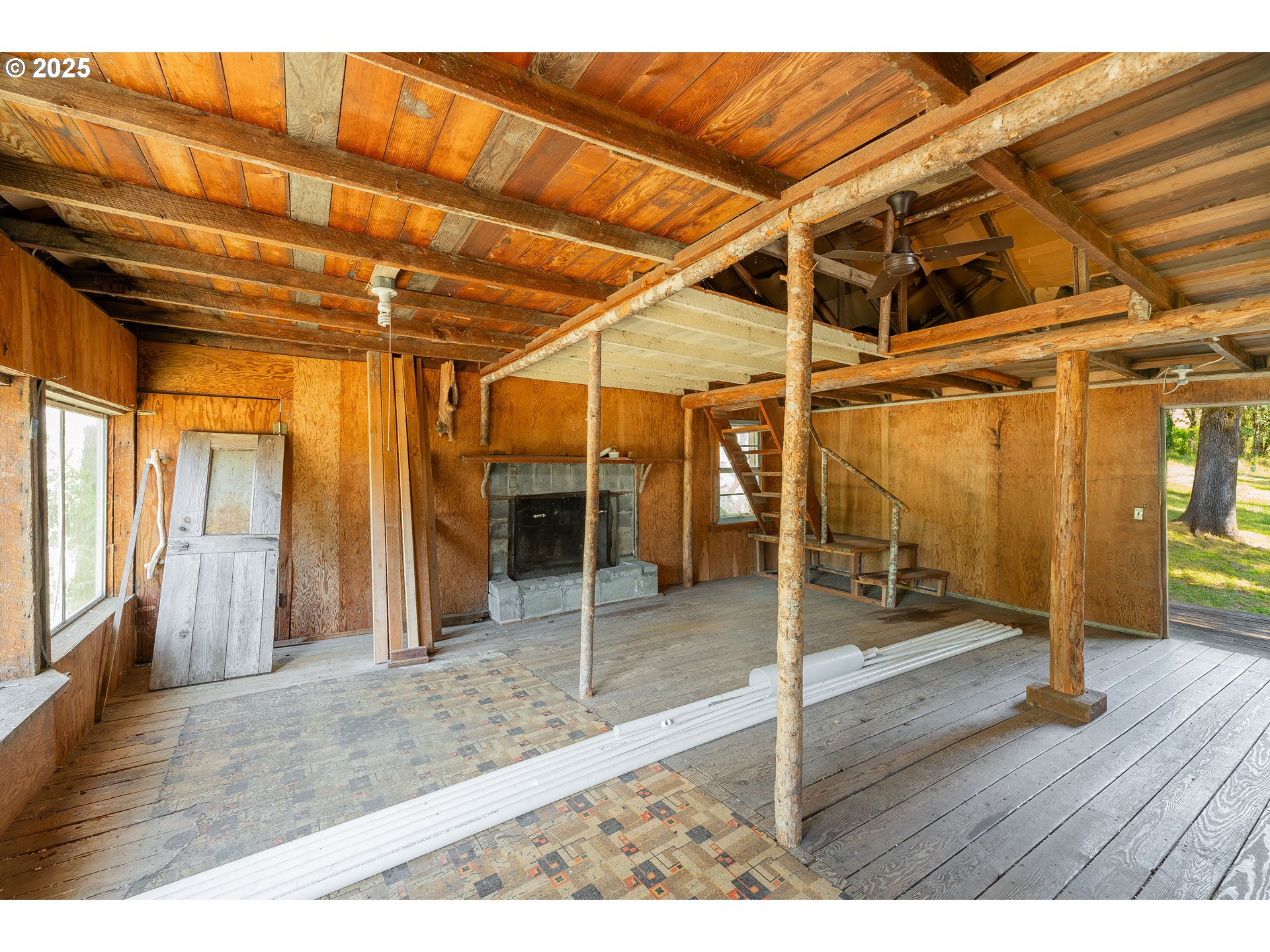 1180 Upper Cleveland Rapids Road Roseburg, OR 97471 - Photo 9 of 42 a view of a room with wooden floor