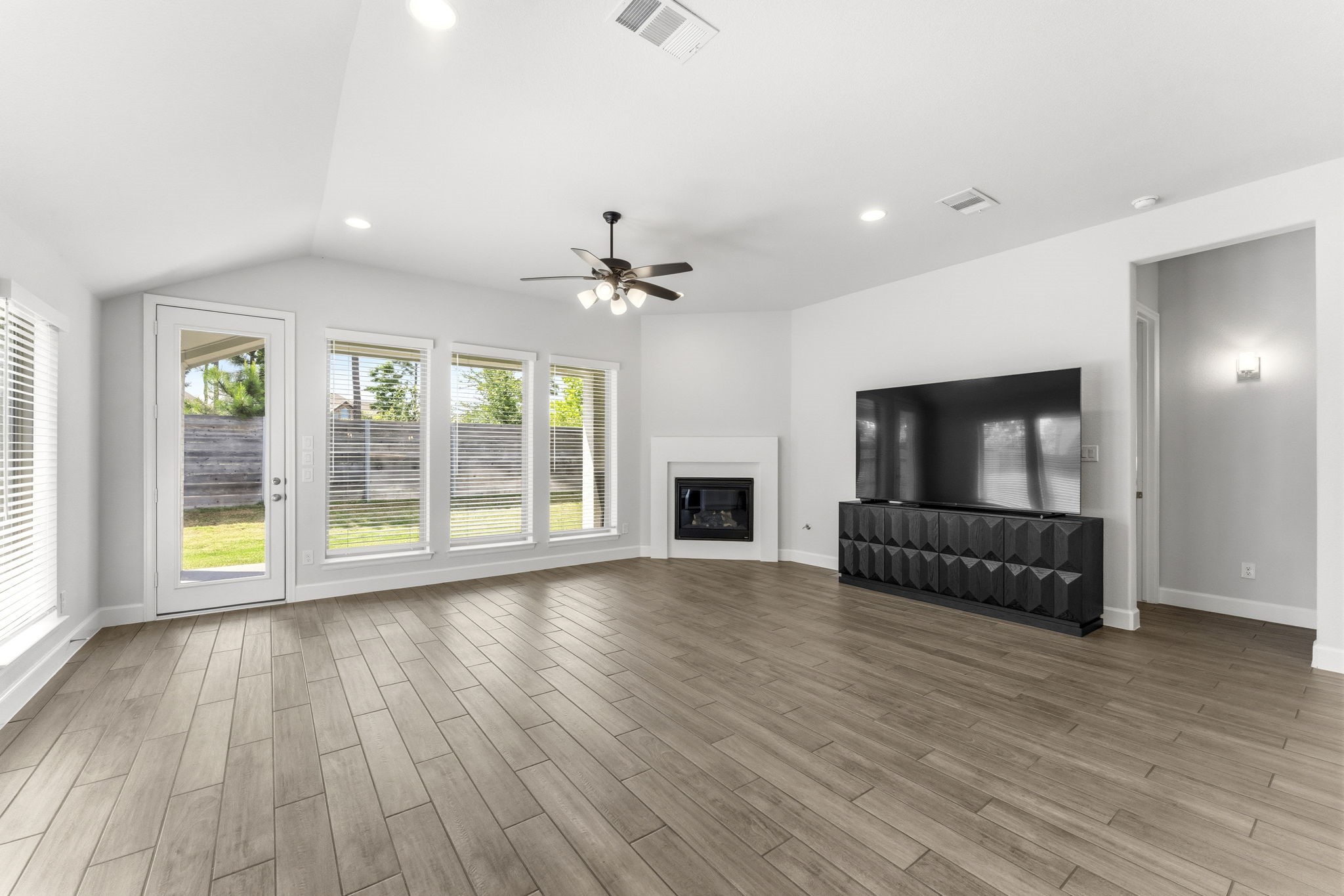 15618 Turtlehead Trail Conroe, TX 77302 - Photo 4 of 50 Spacious Living Area, Corner Gas Log Fireplace w/Remote, Light and Bright, Ceiling Fan and Tile Flooring