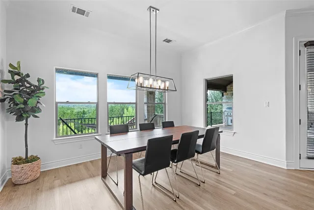 a view of a dining room with furniture window and outside view