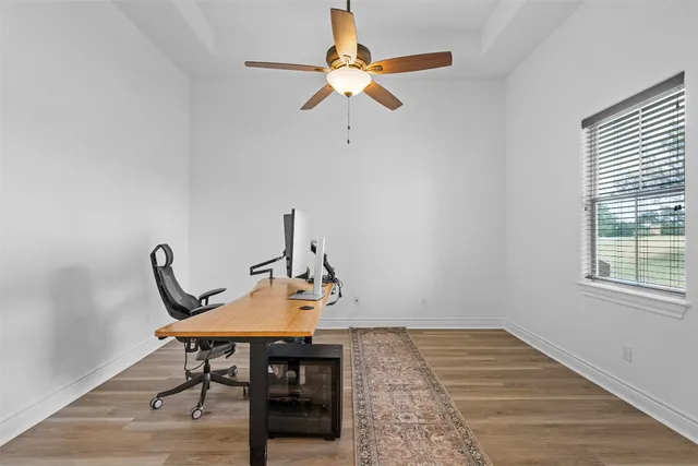 a view of a workspace with furniture