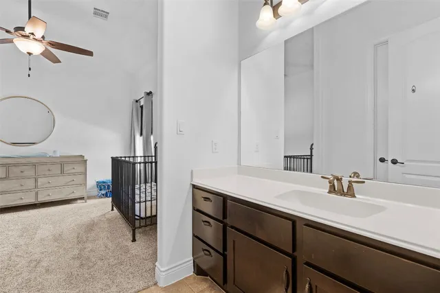 a bathroom with a sink double vanity and a mirror