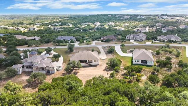 an aerial view of a house with a lake view