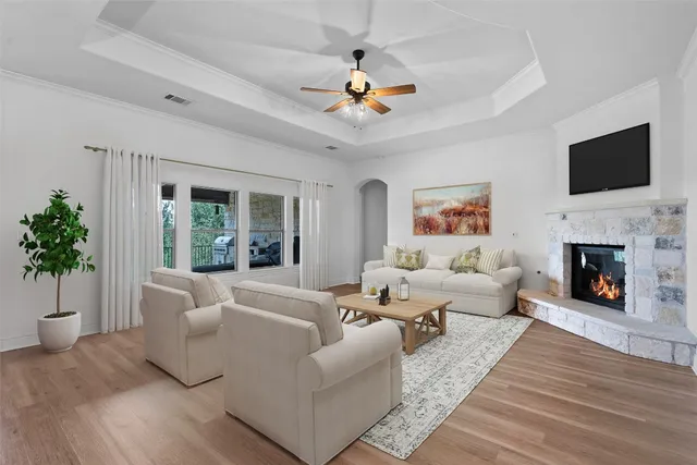 a living room with furniture fireplace and a flat screen tv