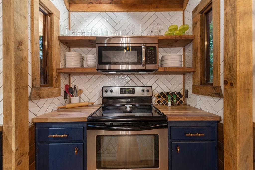 126 Brookwood Drive Blue Ridge, GA 30513 - Photo 38 of 106 a stove top oven sitting inside of a kitchen