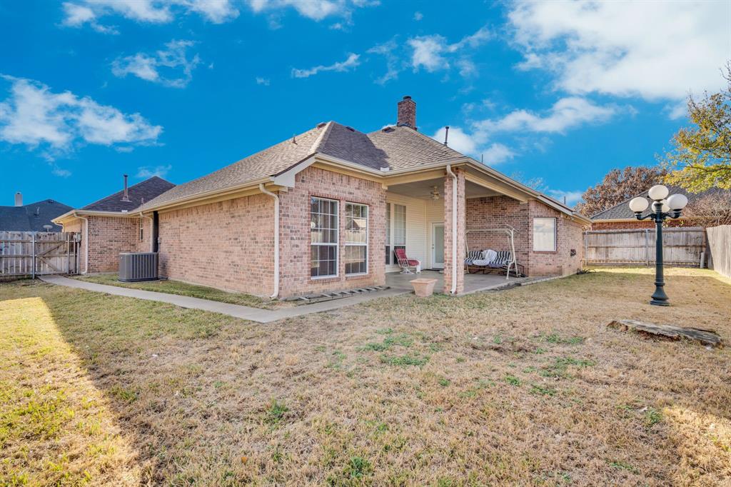 530 Queens Way Grand Prairie, TX 75052 - Photo 24 of 32 a view of a house with a yard