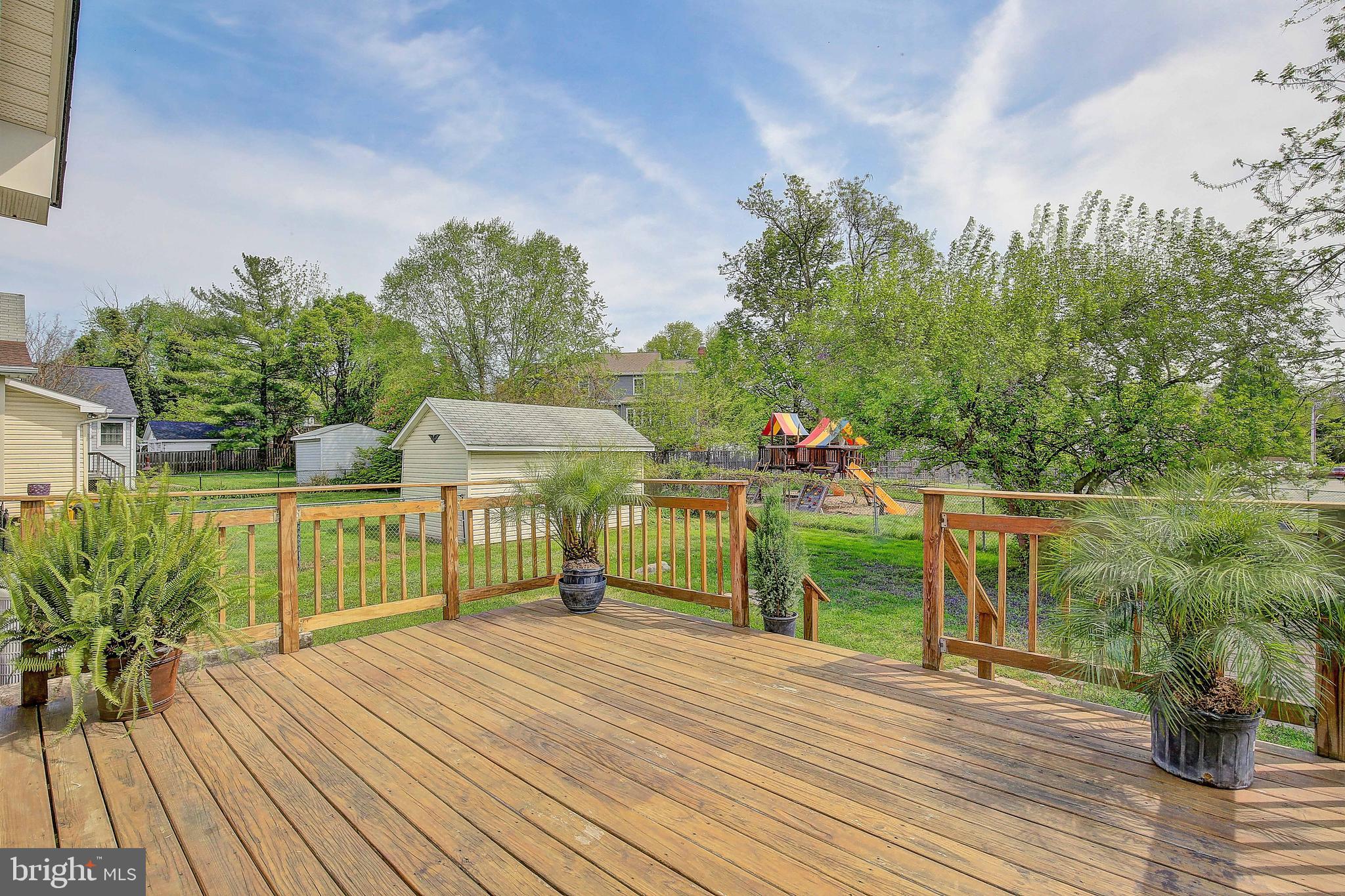 107 North Hammonds Ferry Road Linthicum Heights, MD 21090 - Photo 42 of 43 Large deck with steps to yard and door to kitchen