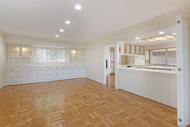 a kitchen with stainless steel appliances granite countertop a refrigerator and a stove