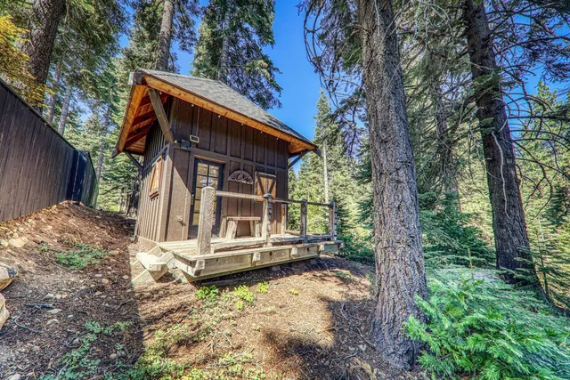 a view of house with a yard