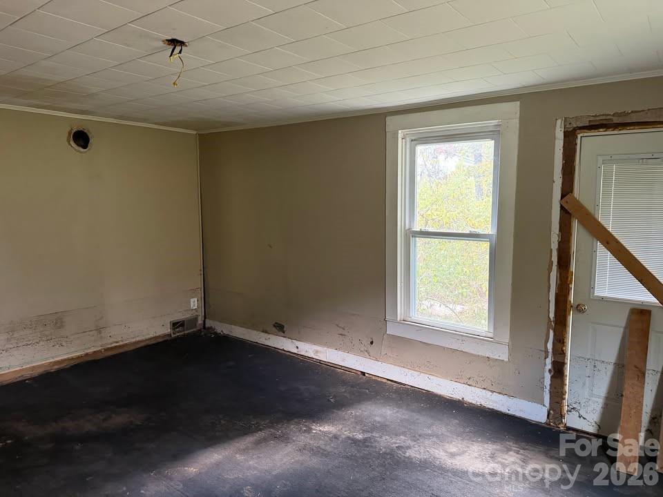 166 Old Helton School Road Lansing, NC 28643 - Photo 13 of 24 an empty room with a window