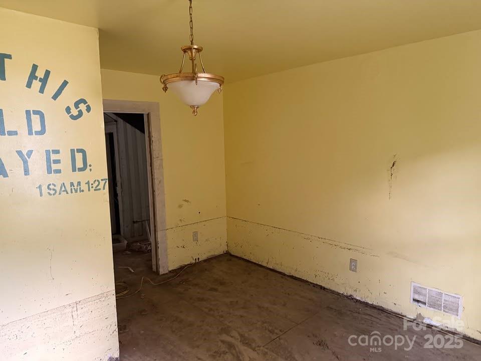 166 Old Helton School Road Lansing, NC 28643 - Photo 15 of 17 a view of a chandelier fan and refrigerator