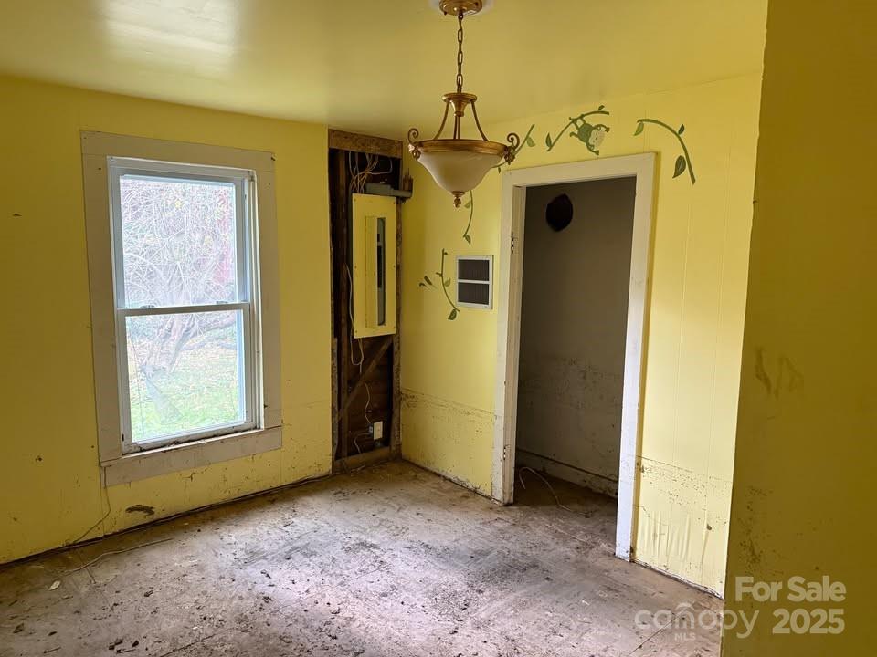 166 Old Helton School Road Lansing, NC 28643 - Photo 16 of 17 a view of a hallway with a wooden door and a porch