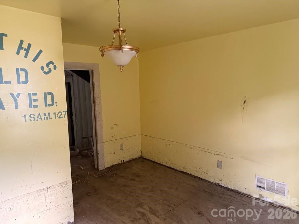 166 Old Helton School Road Lansing, NC 28643 - Photo 19 of 24 a view of a chandelier fan and refrigerator