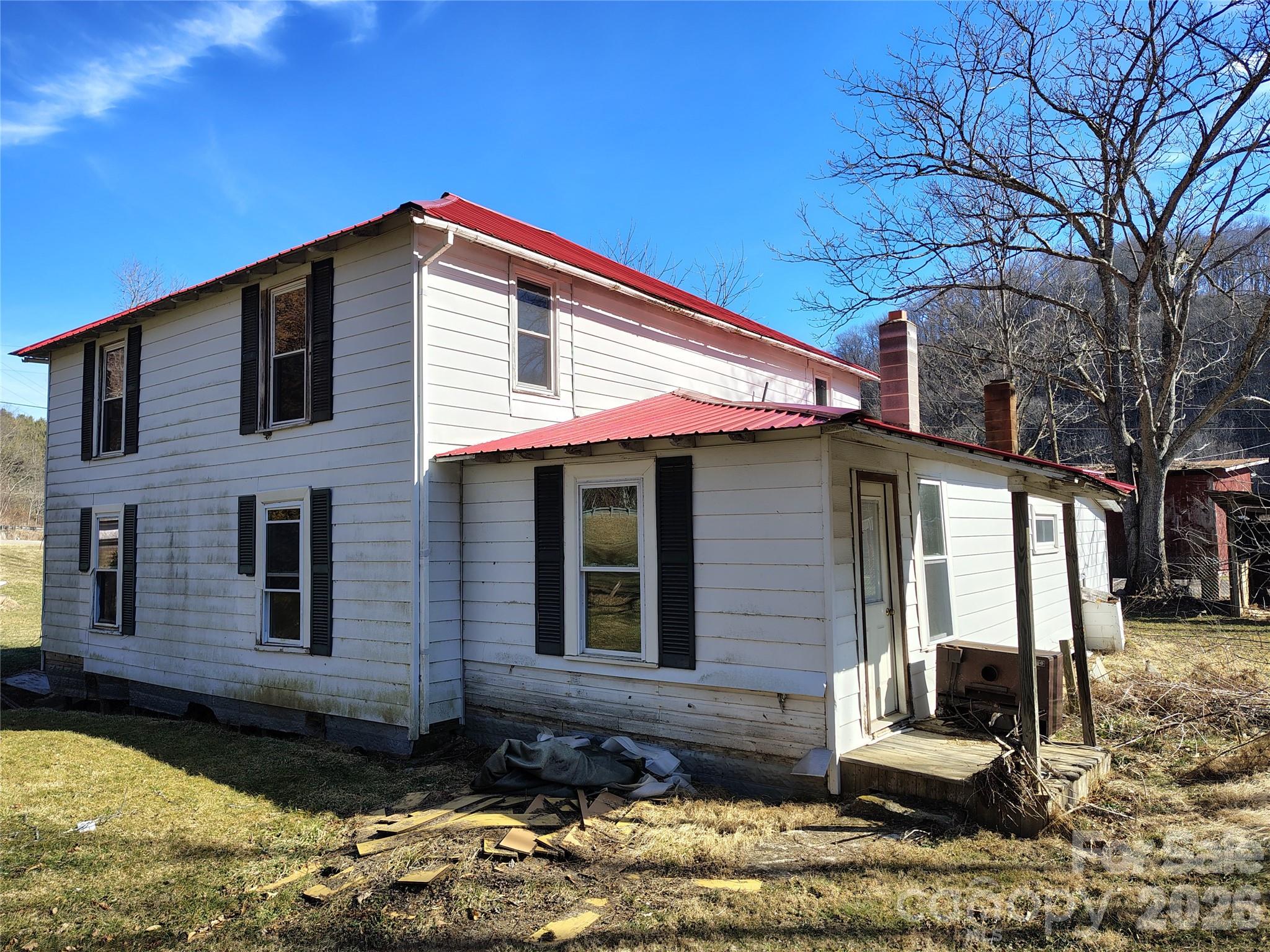 166 Old Helton School Road Lansing, NC 28643 - Photo 2 of 24 a view of a house with a yard