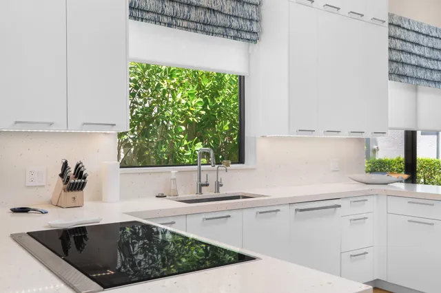 a kitchen with a sink and cabinets