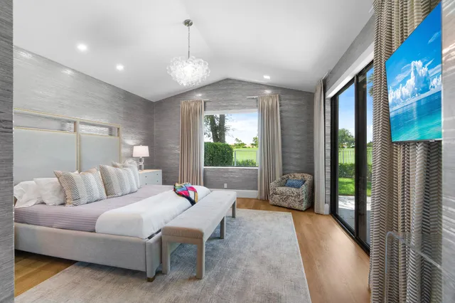 a bed room with furniture and a window