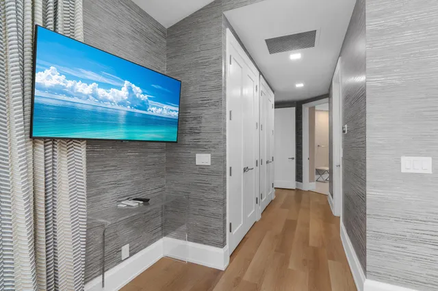 a spacious bathroom with a double vanity sink mirror and toilet