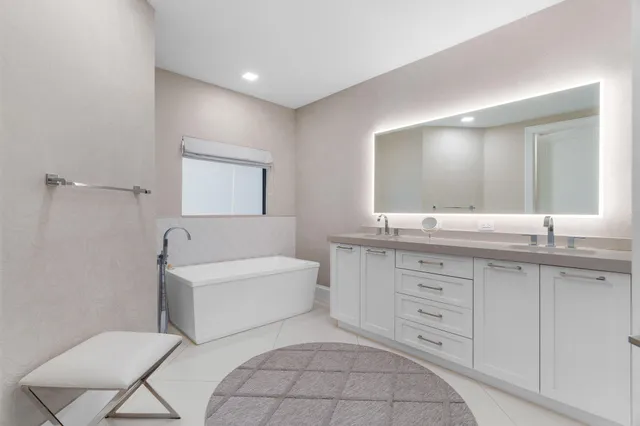 a bathroom with a granite countertop sink mirror and double