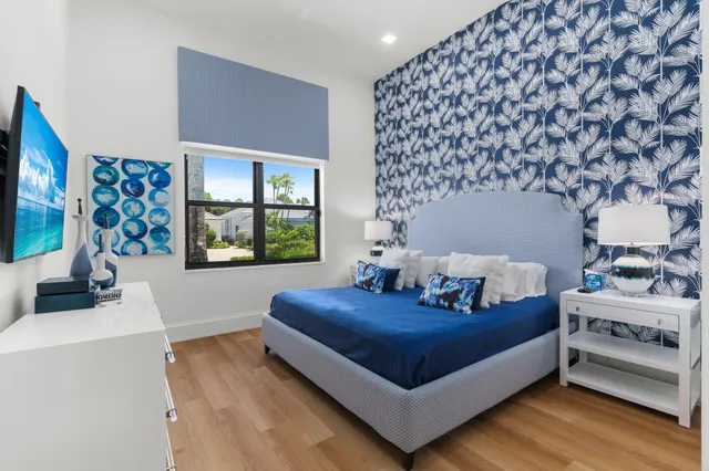 a living room with a couch and a table with wooden floor