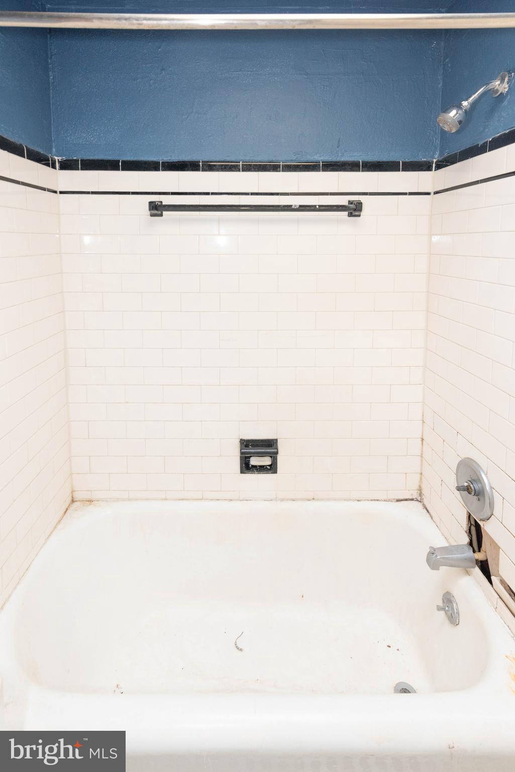 3706 Cranston Avenue Baltimore, MD 21229 - Photo 12 of 29 a bathroom with a bathtub and a shower