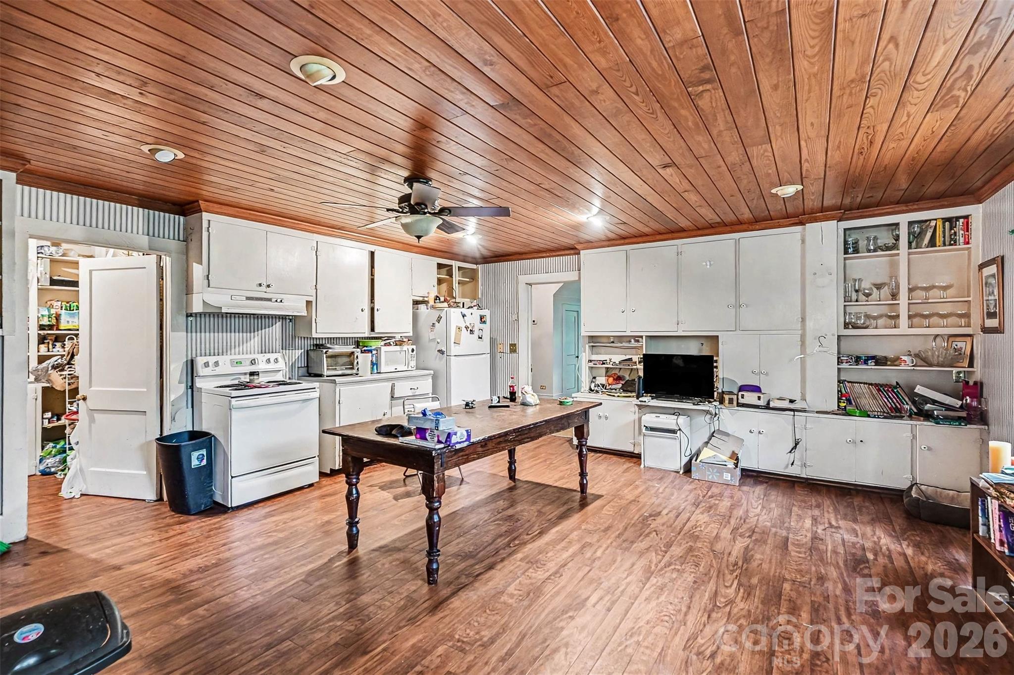 1116 Medlin Road Monroe, NC 28112 - Photo 18 of 40 a living room with furniture and a wooden floor