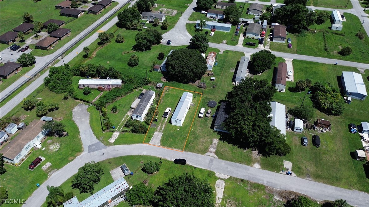 951 Virginia Avenue Clewiston, FL 33440 - Photo 15 of 17 an aerial view of a large garden with lots of residential buildings
