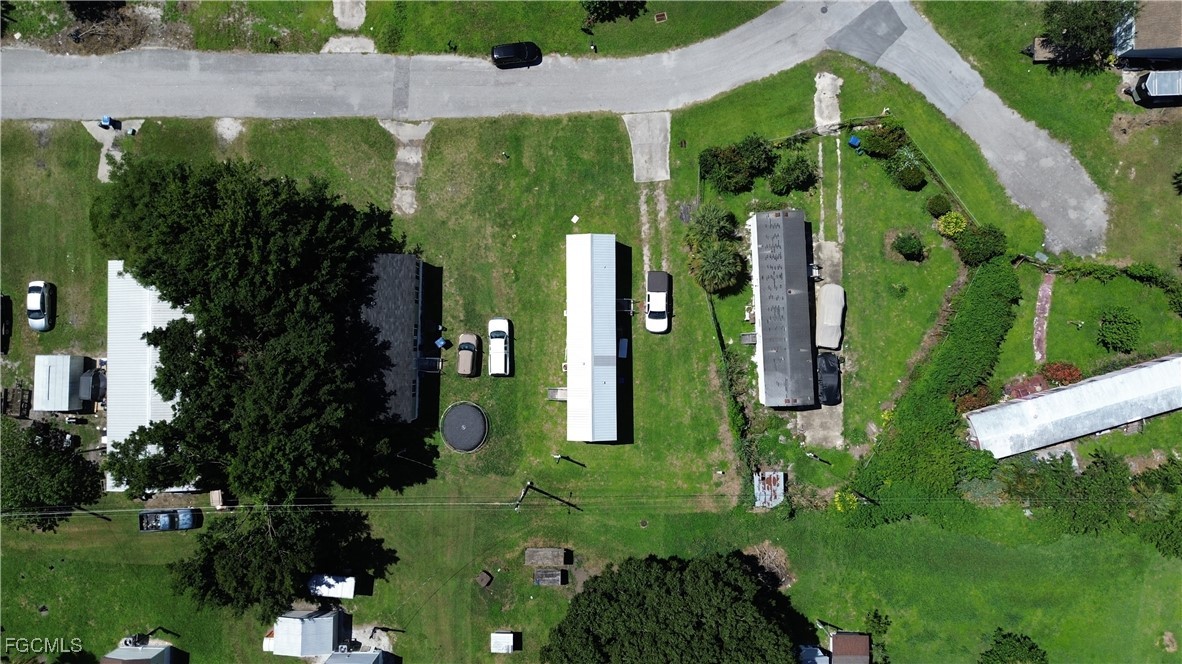 951 Virginia Avenue Clewiston, FL 33440 - Photo 17 of 17 an aerial view of a house having swimming pool a yard and outdoor seating