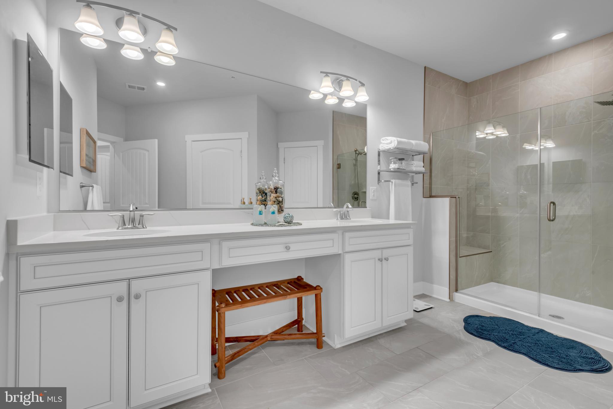 111 Marshgrass Way, Unit 21 Chester, MD 21619 - Photo 25 of 57 a spacious bathroom with a double vanity sink mirror and double