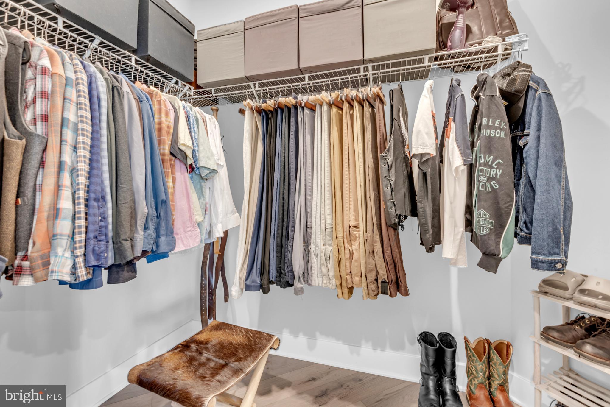 111 Marshgrass Way, Unit 21 Chester, MD 21619 - Photo 28 of 57 a view of walk in closet with clothes