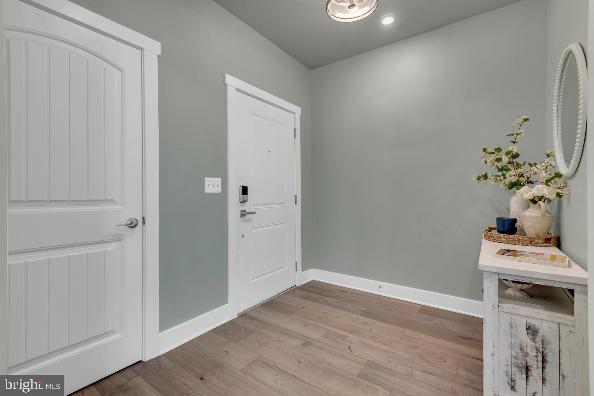 111 Marshgrass Way, Unit 21 Chester, MD 21619 - Photo 4 of 57 a view of an entryway with wooden floor