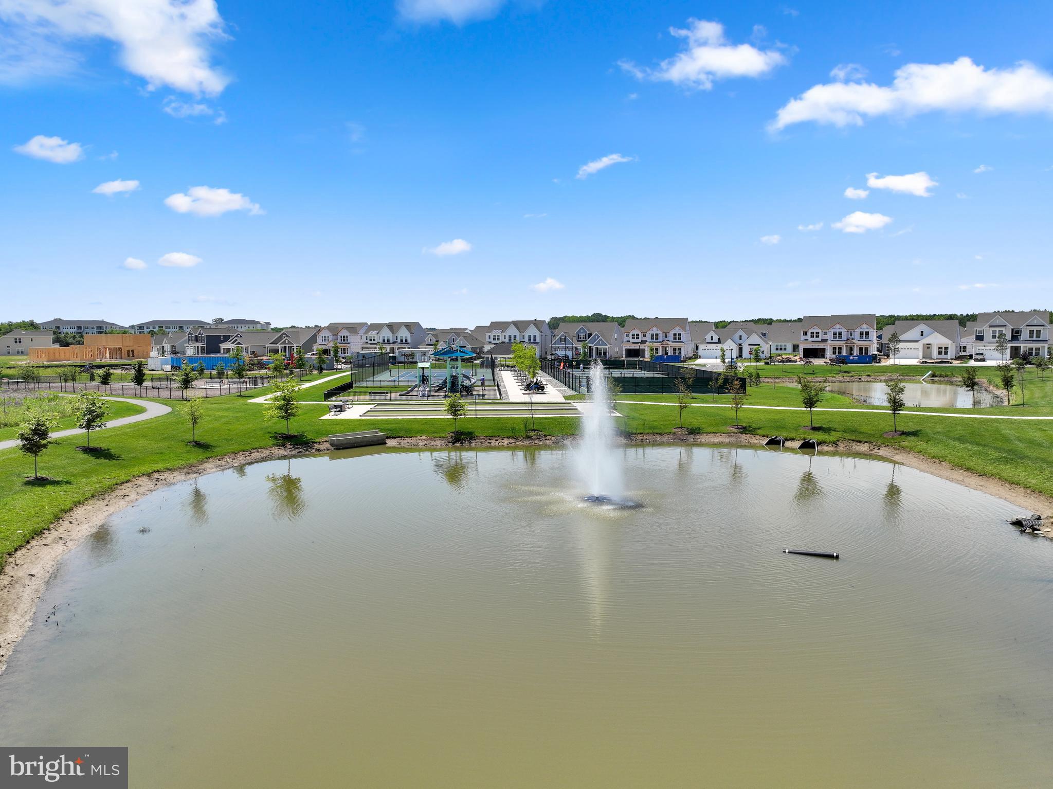 111 Marshgrass Way, Unit 21 Chester, MD 21619 - Photo 42 of 57 a view of a lake with houses