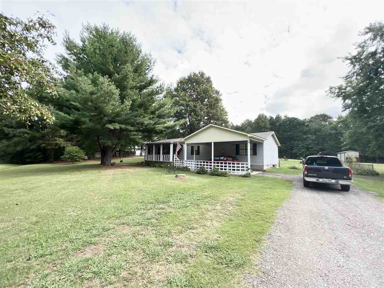 62 Rabbit Trail Road Ripley, TN 38063 - Photo 3 of 11 a car parked in front of a house with a yard