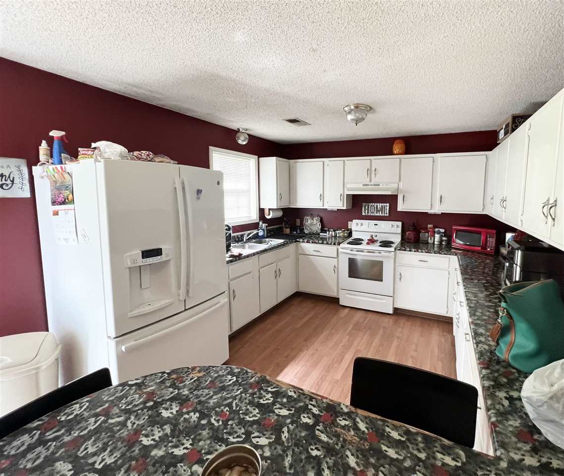 62 Rabbit Trail Road Ripley, TN 38063 - Photo 10 of 11 a kitchen with stainless steel appliances granite countertop a refrigerator sink and stove