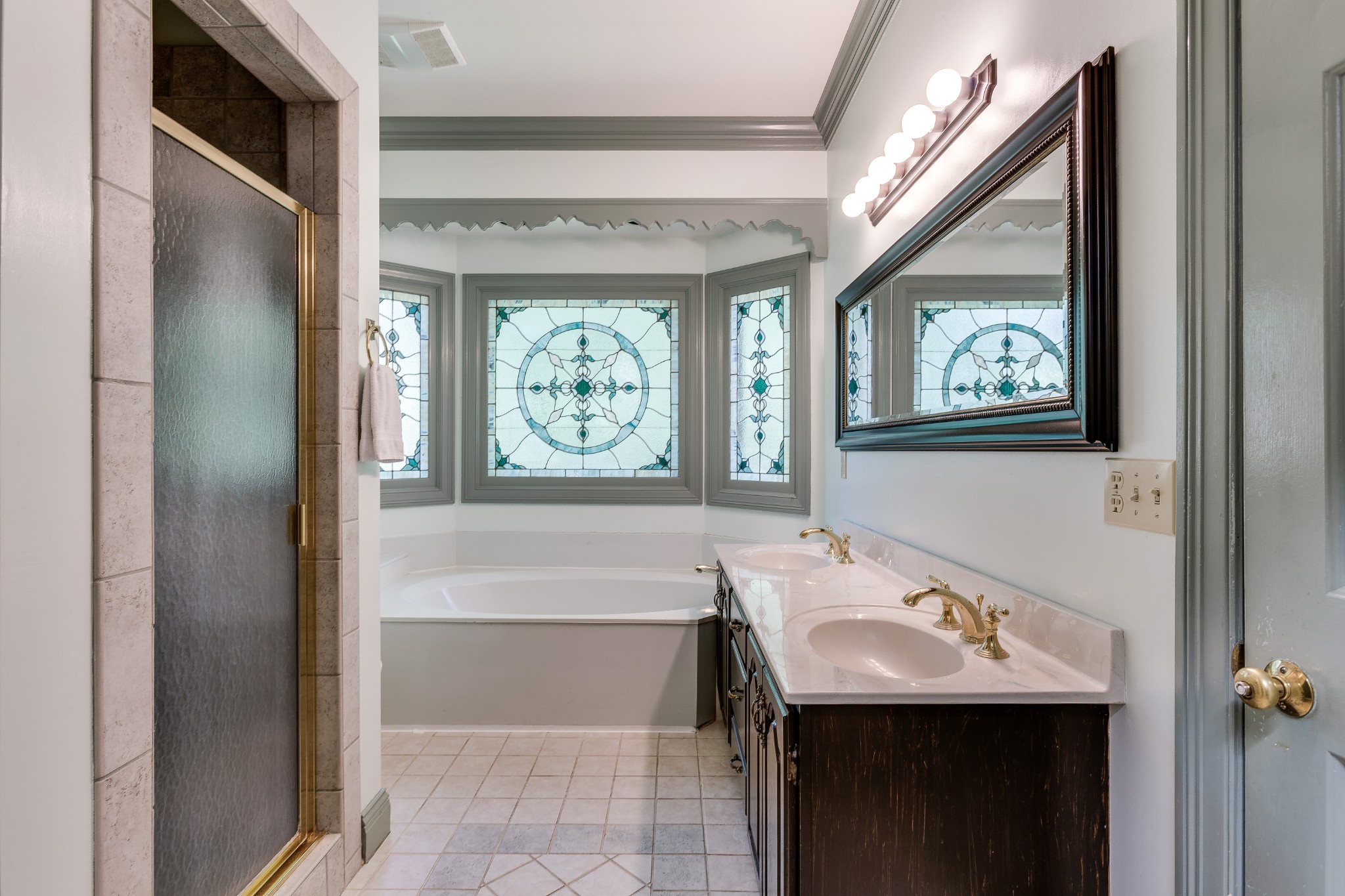 1111 Temple Ridge Court Nashville, TN 37221 - Photo 29 of 46 a bathroom with a sink and a mirror