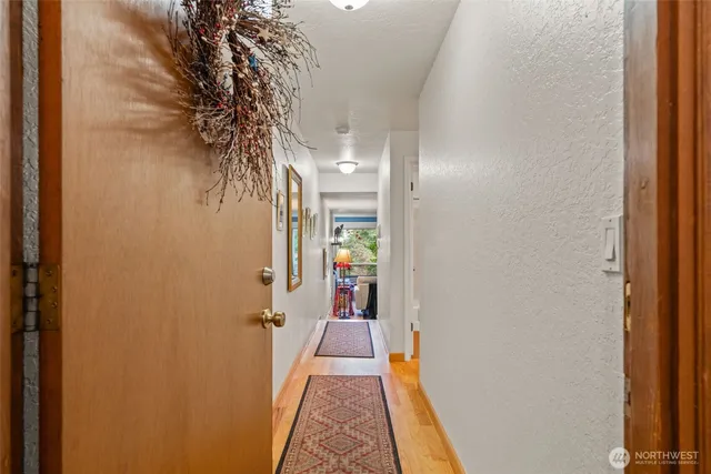 a view of a hallway with a room