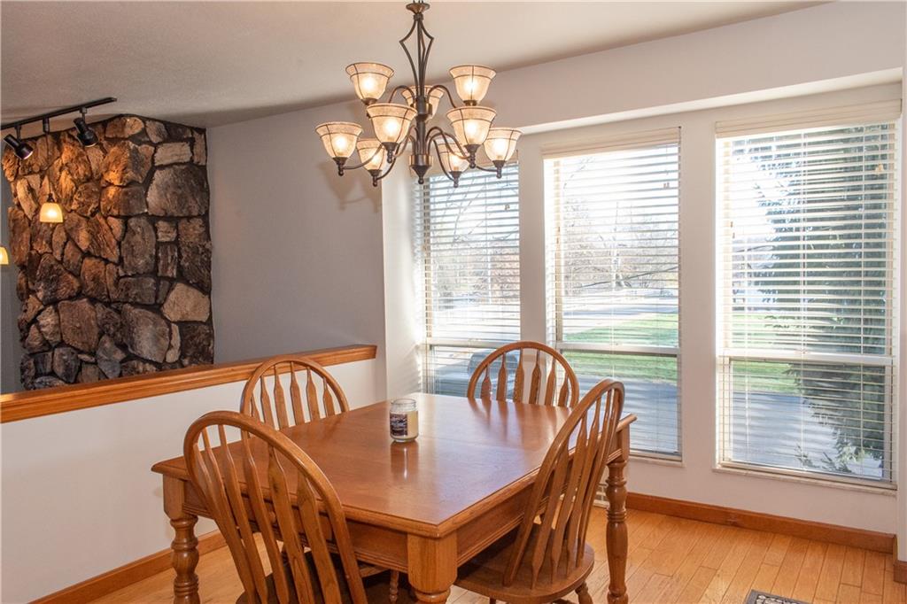 1099 Riverside Drive, Unit A Beaver, PA 15009 - Photo 11 of 49 a view of a dining room with furniture wooden floor and chandelier