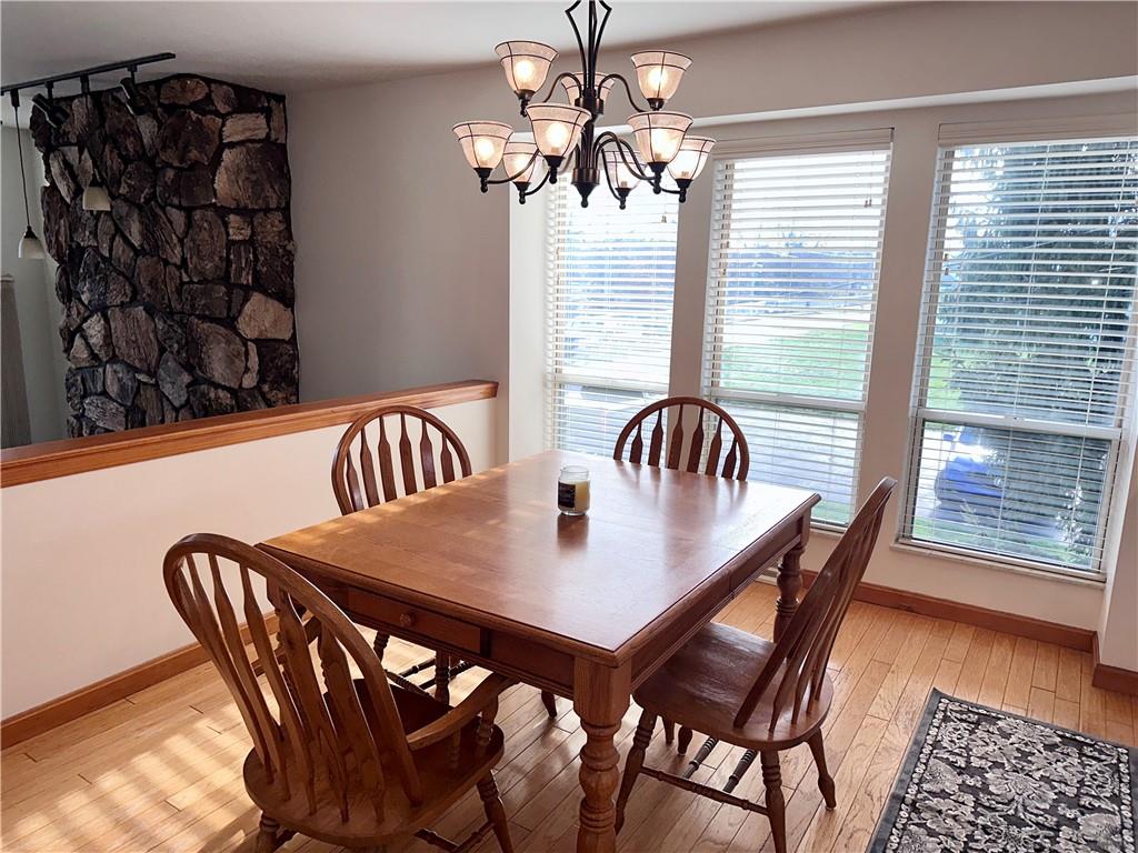 1099 Riverside Drive, Unit A Beaver, PA 15009 - Photo 13 of 49 a view of a dining room with furniture and wooden floor