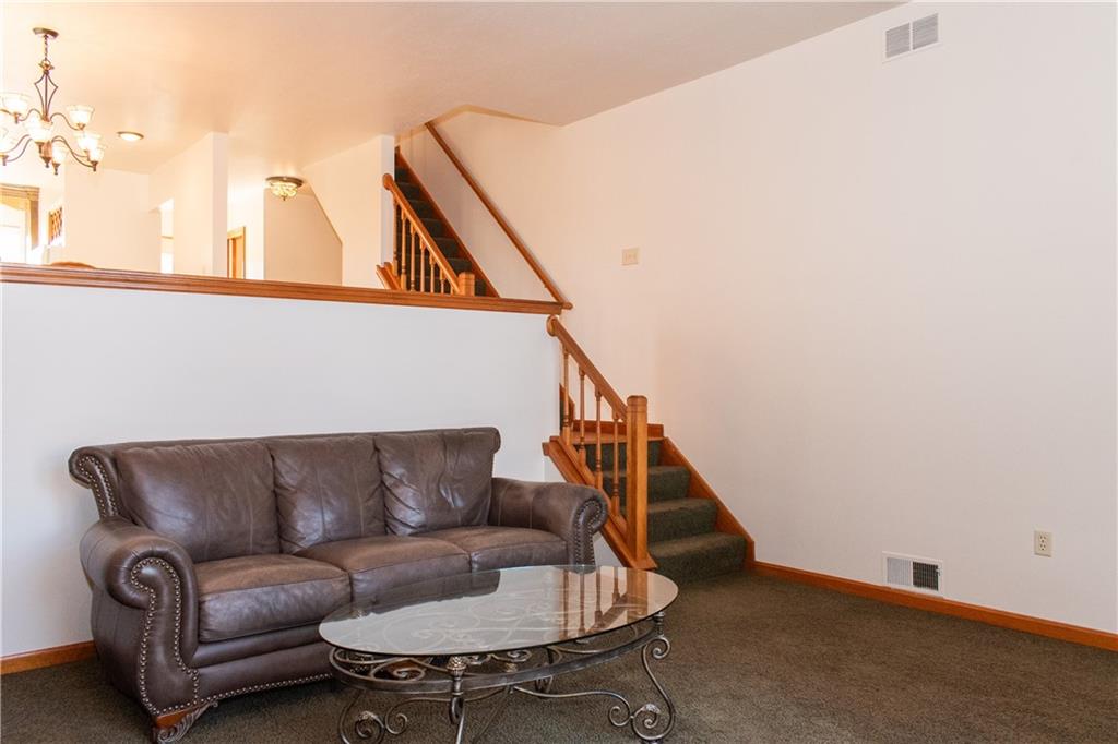 1099 Riverside Drive, Unit A Beaver, PA 15009 - Photo 17 of 49 a living room with furniture and a wooden floor