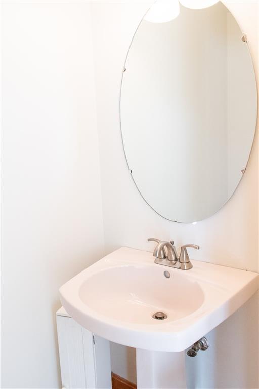 1099 Riverside Drive, Unit A Beaver, PA 15009 - Photo 20 of 49 a bathroom with a sink and a mirror
