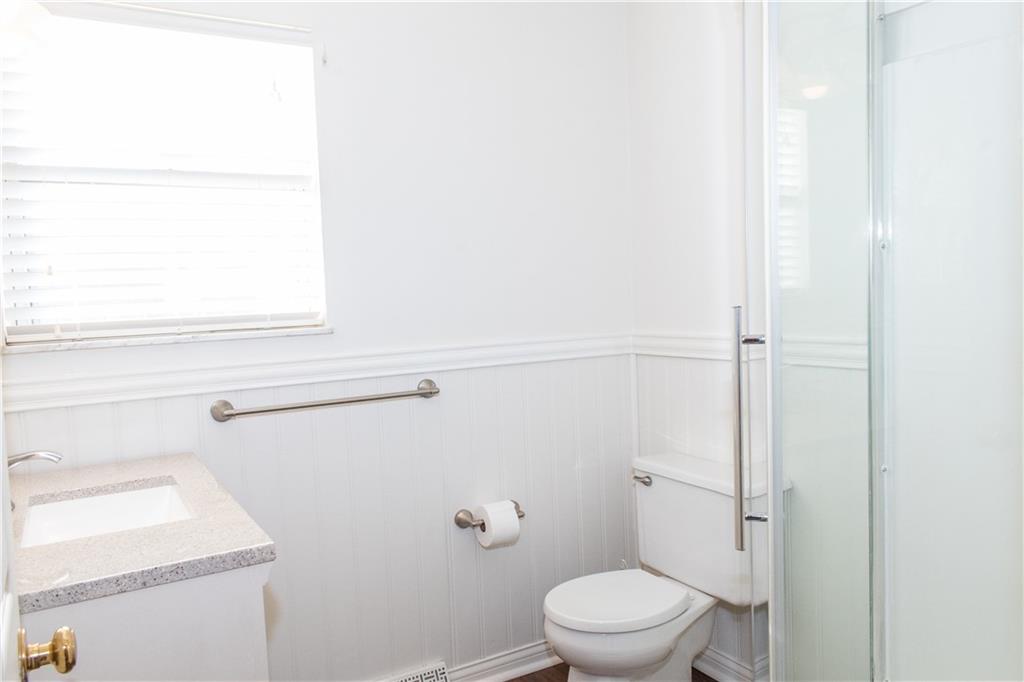 1099 Riverside Drive, Unit A Beaver, PA 15009 - Photo 24 of 49 a white toilet sitting next to a window