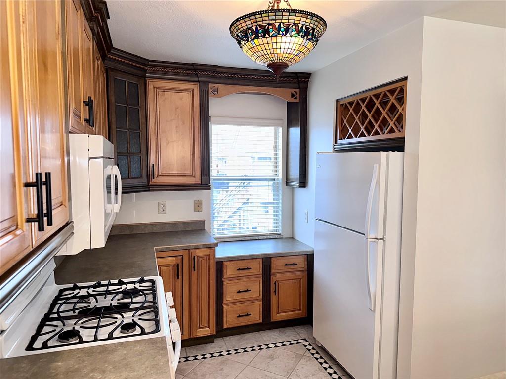 1099 Riverside Drive, Unit A Beaver, PA 15009 - Photo 3 of 49 a kitchen with a refrigerator and a stove