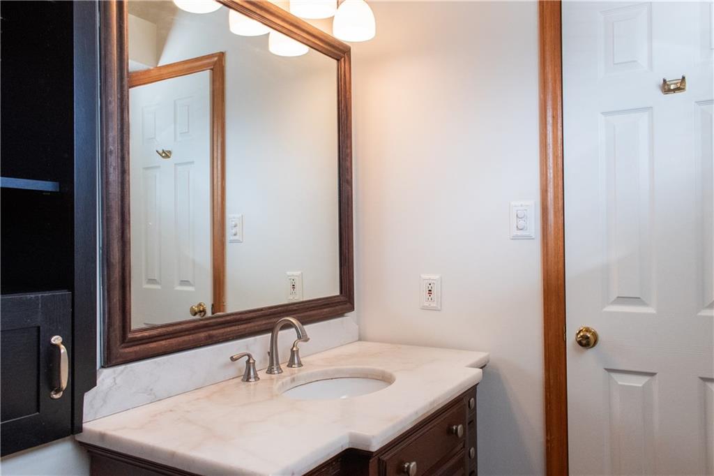 1099 Riverside Drive, Unit A Beaver, PA 15009 - Photo 38 of 49 a bathroom with a sink and a mirror