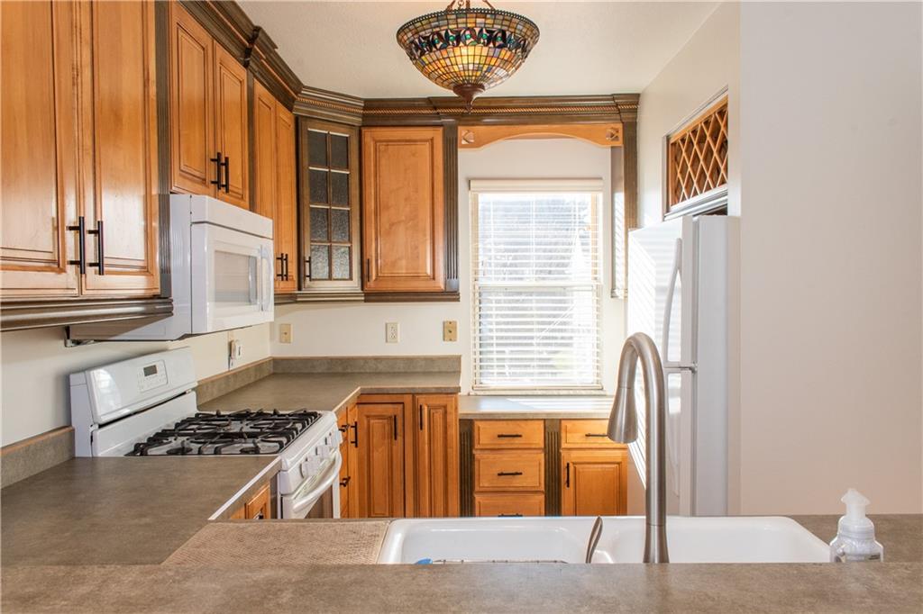 1099 Riverside Drive, Unit A Beaver, PA 15009 - Photo 4 of 49 a kitchen with stainless steel appliances granite countertop a stove and a refrigerator