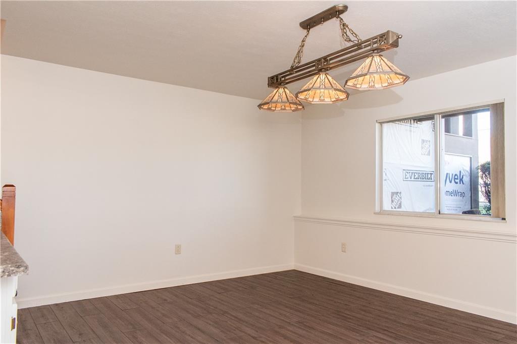1099 Riverside Drive, Unit A Beaver, PA 15009 - Photo 44 of 49 a view of a room with wooden floor and windows