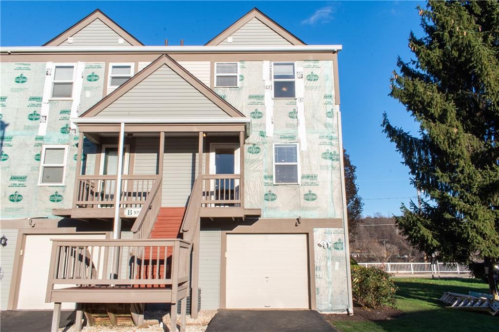 1099 Riverside Drive, Unit A Beaver, PA 15009 - Photo 45 of 49 front view of a house with a yard